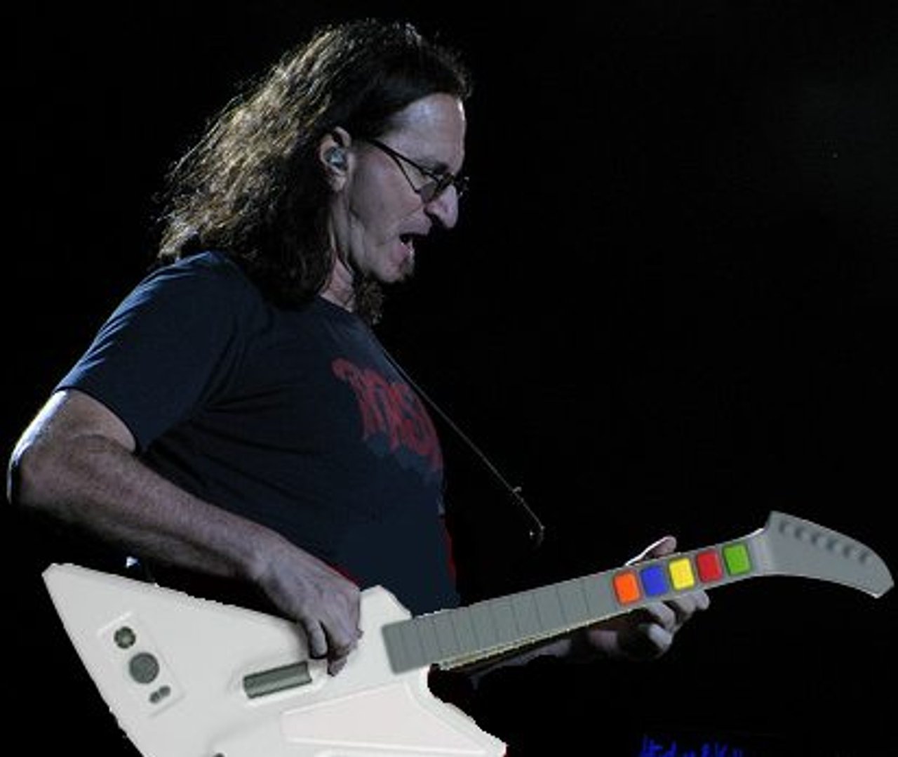 A real guitar hero (Photo illustration: Geddy by ceedub13, guitar from Guitar Hero)