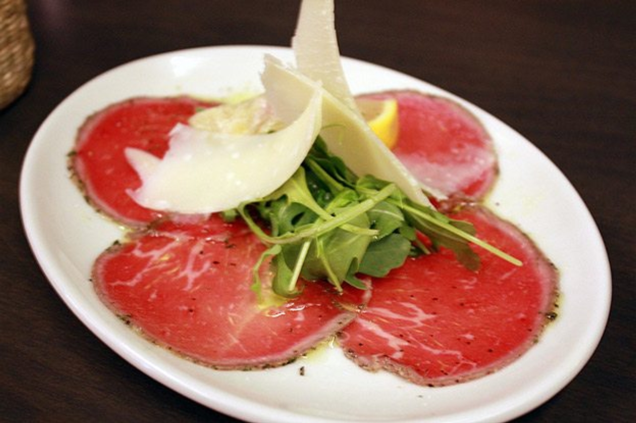 Beef carpaccio with arugula, artichoke and shaved parmigiano ($8)