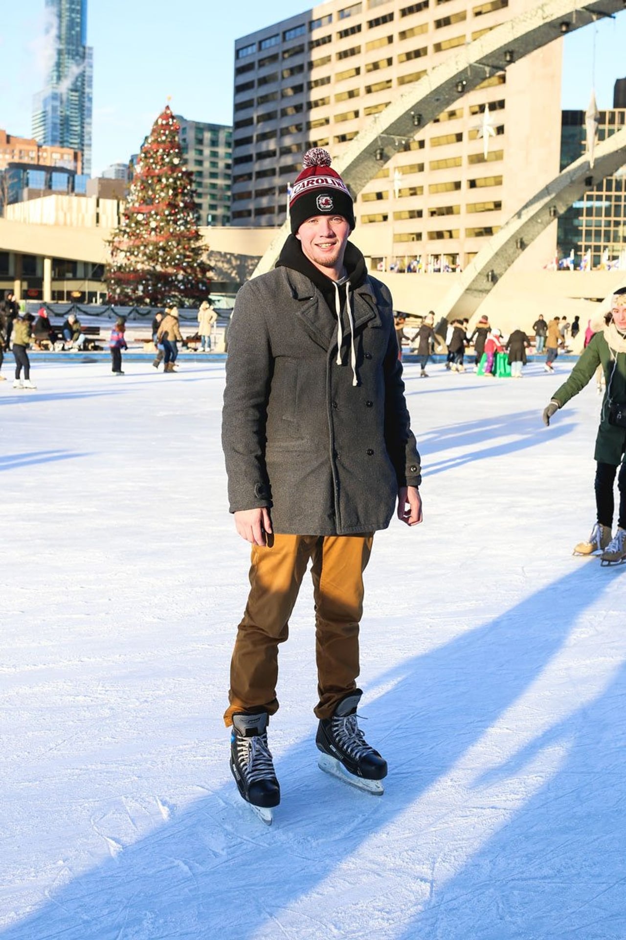 Street Style: bundled-up out-of-towners and students show off their ice-skating style at Nathan Phillips Square