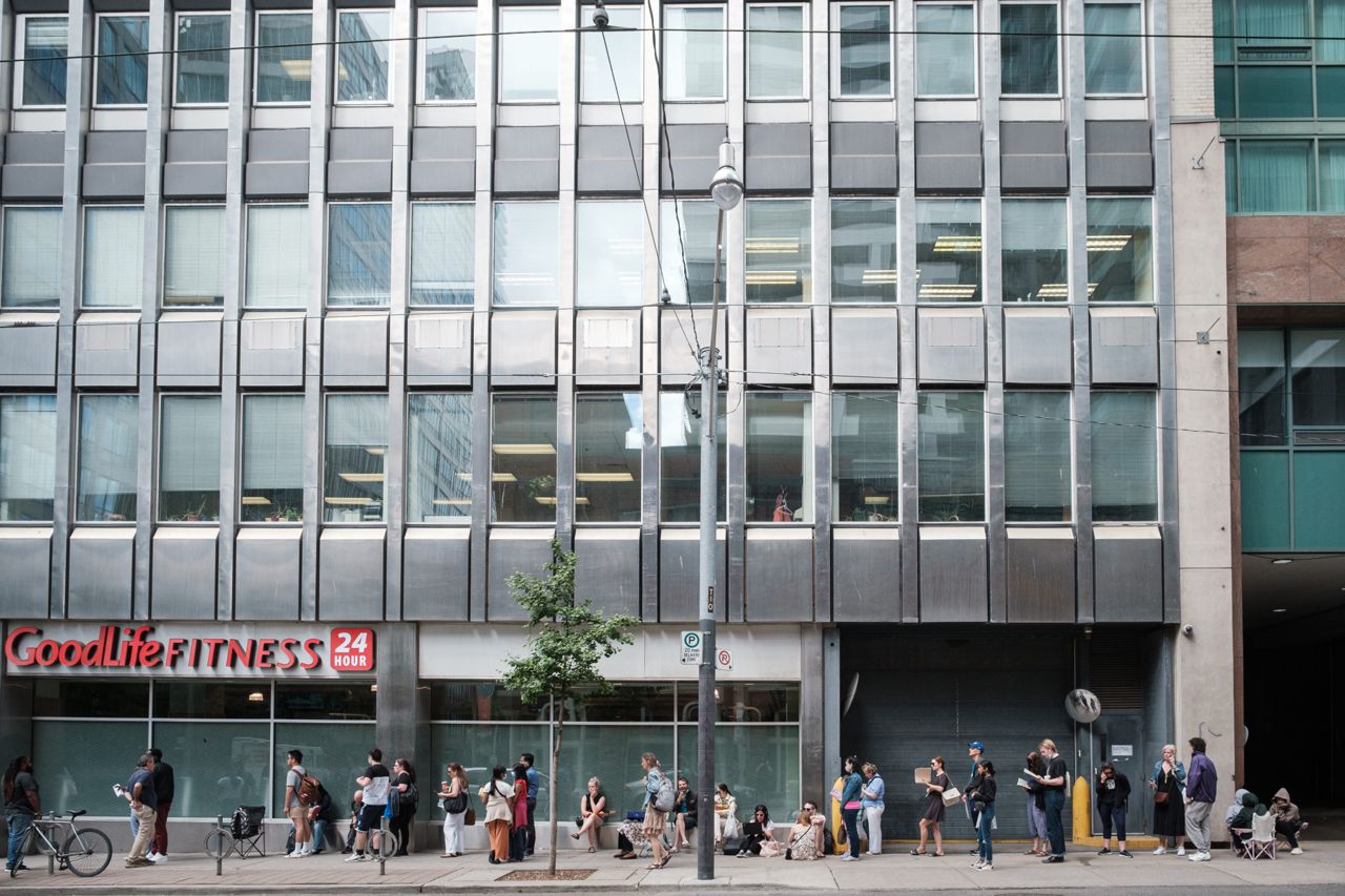 "It's kind of like everyone for themselves right now": What it's like in the lineup at a downtown passport renewal office