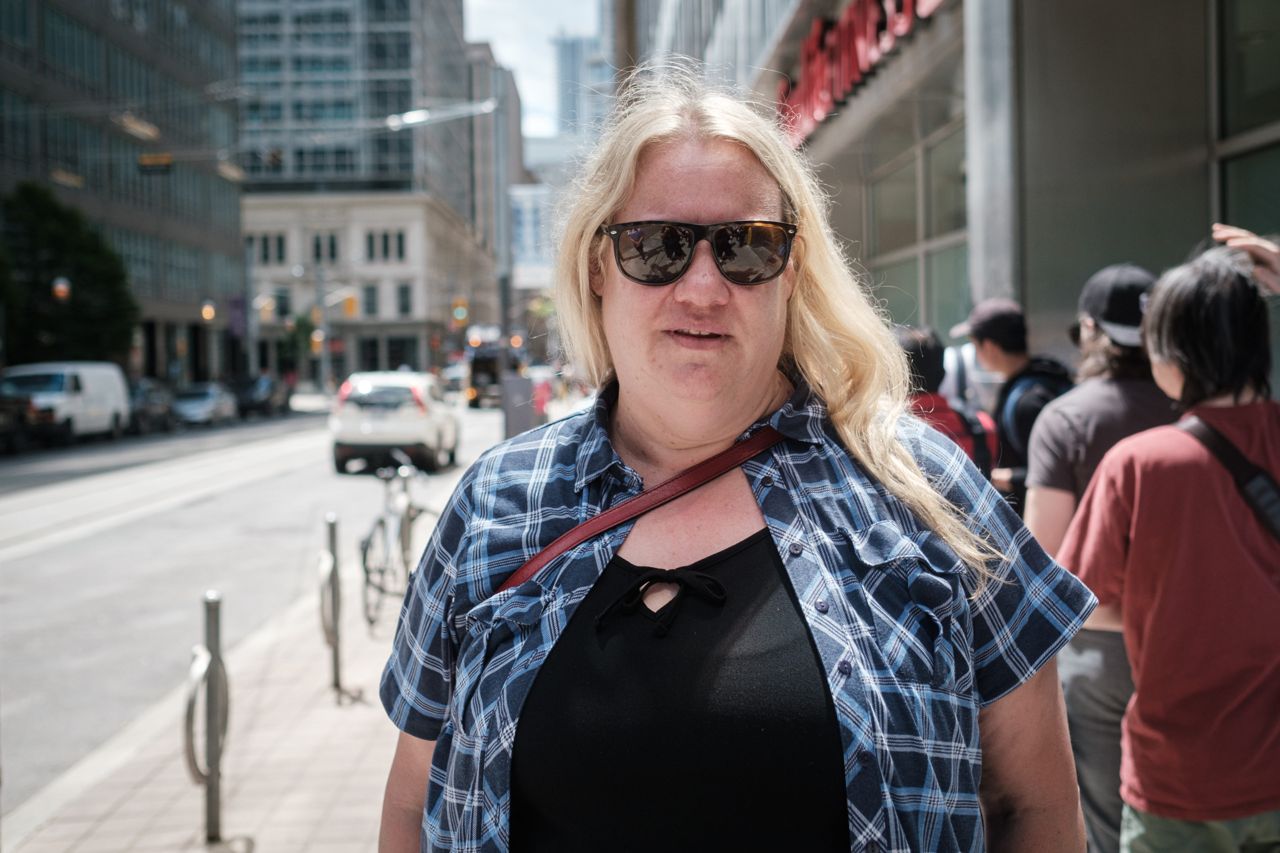 "It's kind of like everyone for themselves right now": What it's like in the lineup at a downtown passport renewal office