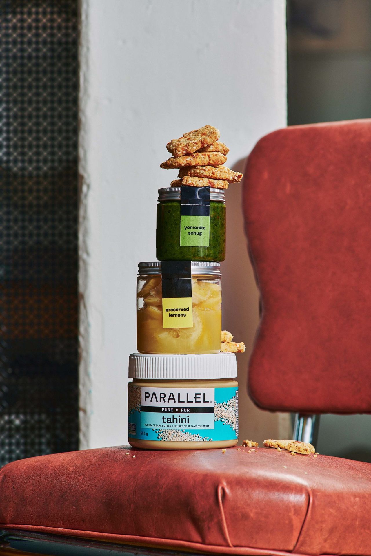 Jars of house-made tahini, preserved lemon and zhug, all for sale at Parallel Basta in Toronto
