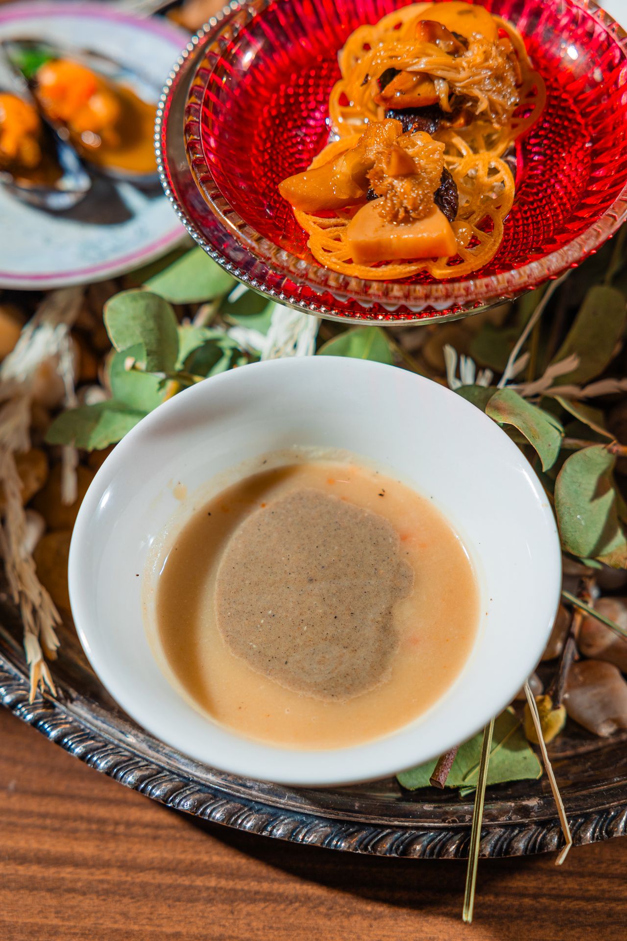 A small bowl full of a beige liquid