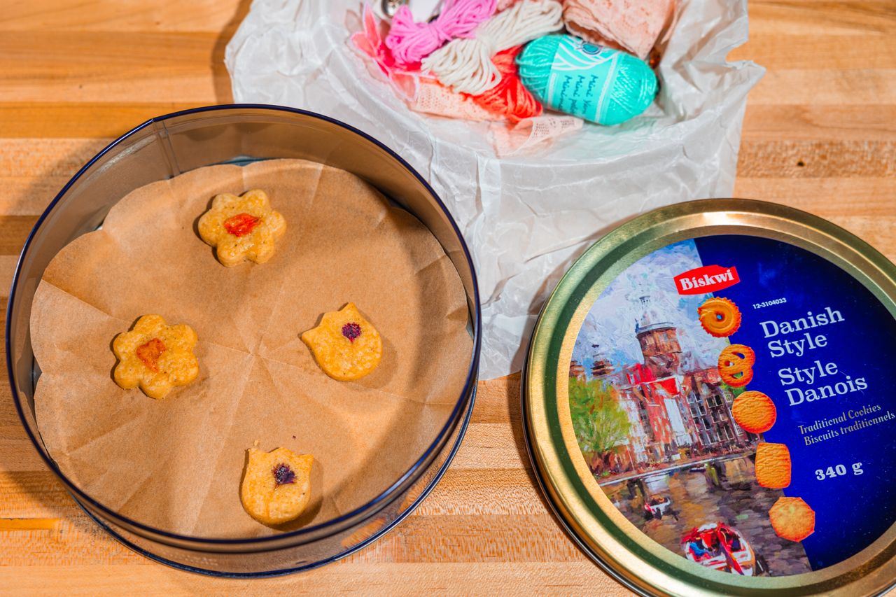 A tin of four small shortbread cookies