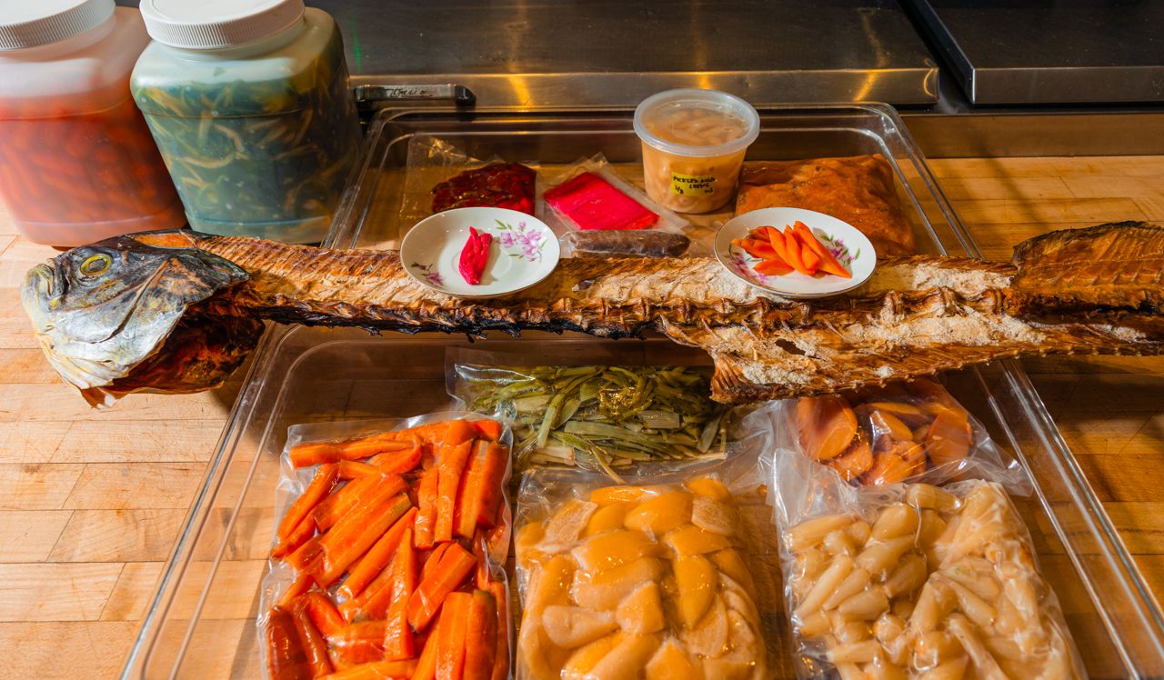 A large tray of pickled and dry aged items