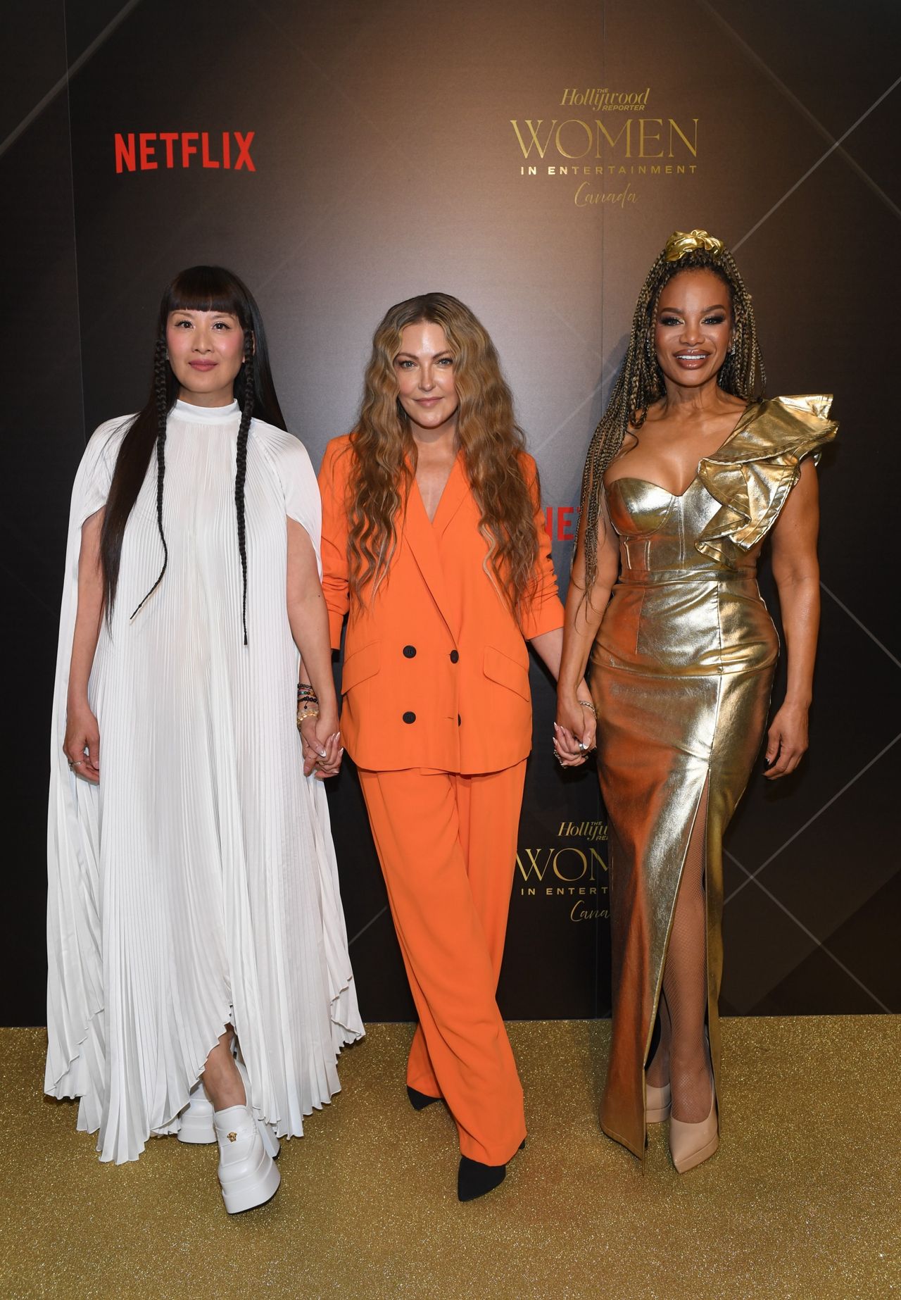 Lainey Lui, Cheryl Hickey and Traci Melchor on the gold carpet at the Hollywood Reporter Women in Entertainment Canada gala