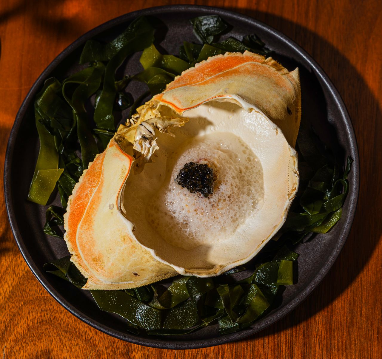 For this dish, BC Dungeness crab, served in its own shell, is topped with a cloud of almond foam and a spoonful of caviar from Acadian Sturgeon and Caviar Inc.