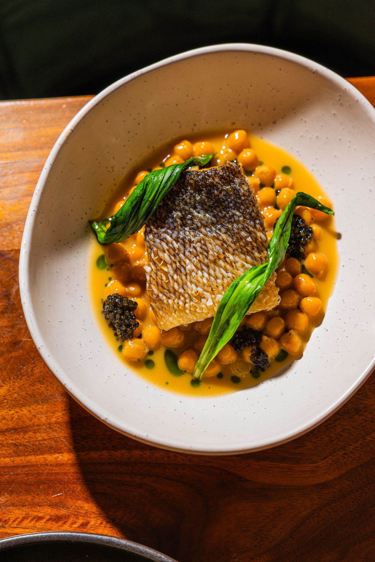 Here we have Ontario pickerel, pan-fried until crisp and resting in zuppetta di ceci, then finished with Ontario ramps and a few dollops of caviar