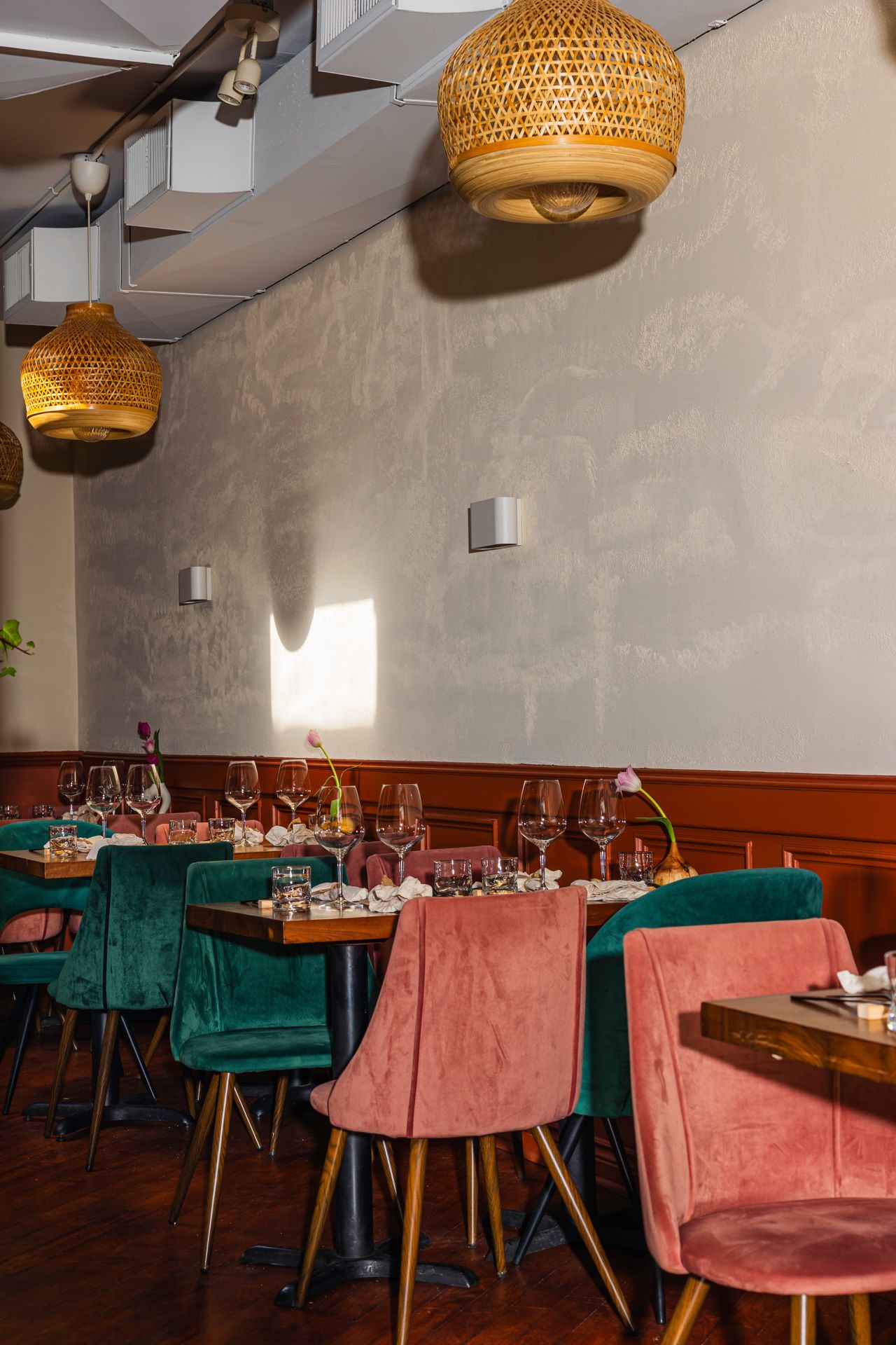 Four-top tables in the back dining room of Radici Project