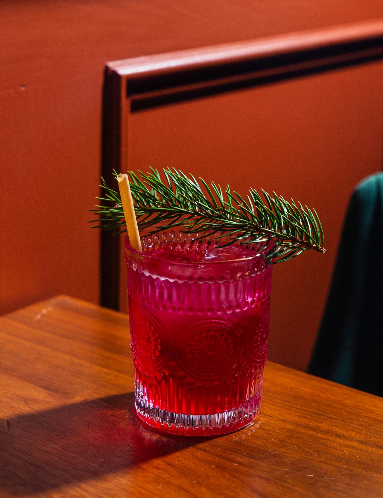 A base of bold black tea is mixed with beet kombucha and pine syrup, then topped with soda