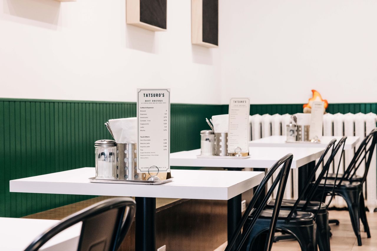 Two-top tables inside the dining room at Tatsuro's