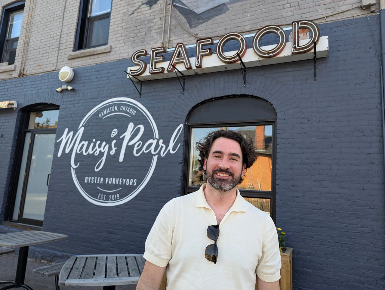 Chef Eric Robertson stands outside Maisy's Pearl in Hamilton
