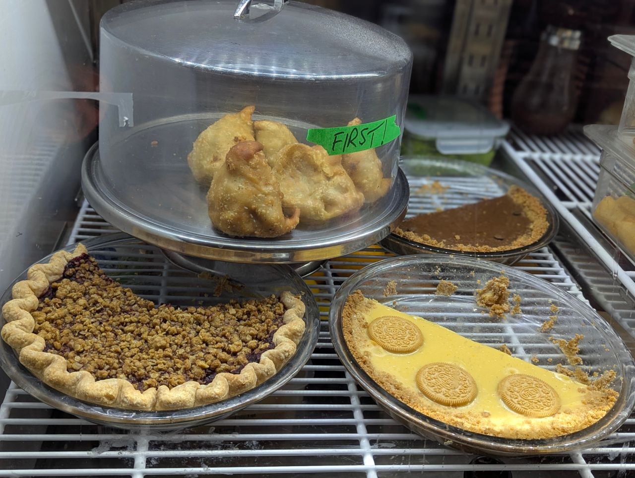 A selection of pies inside a display case