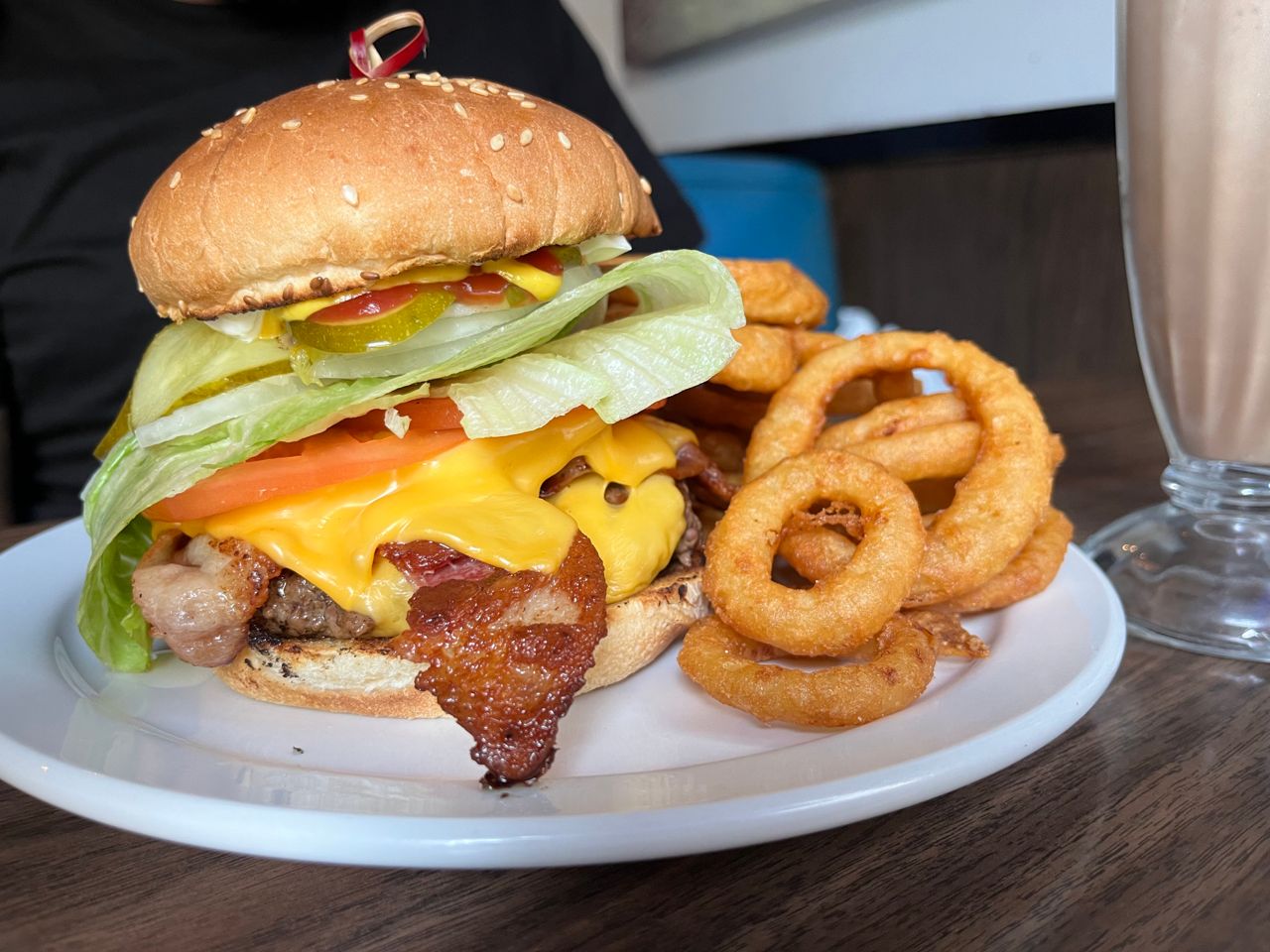 A banquet burger with a side of onion rings