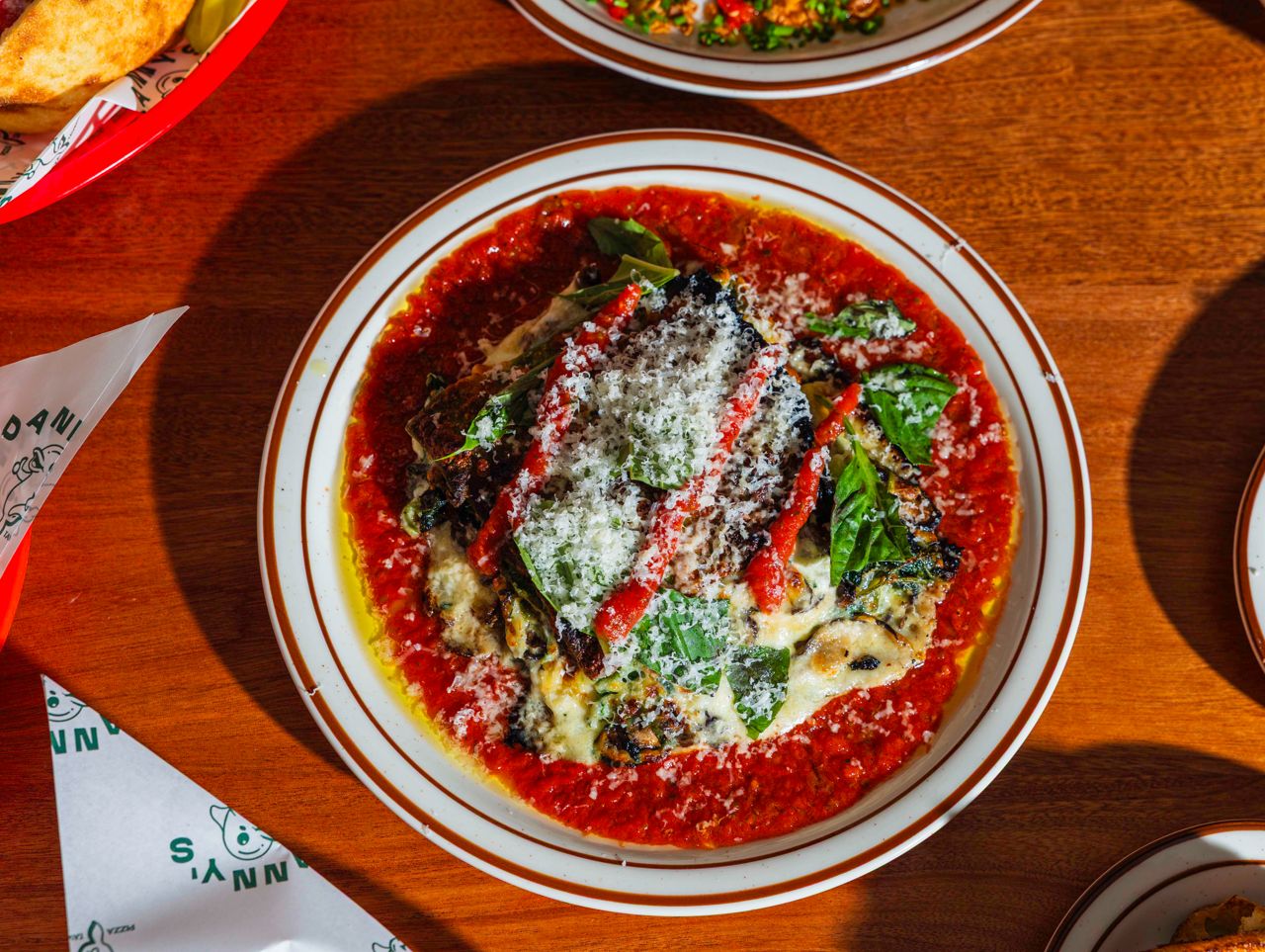 The lasagna verde layers sheets of house-made spinach pasta with mozzarella and pecorino cheese sauce, sautéed spinach and white wine roasted mushrooms