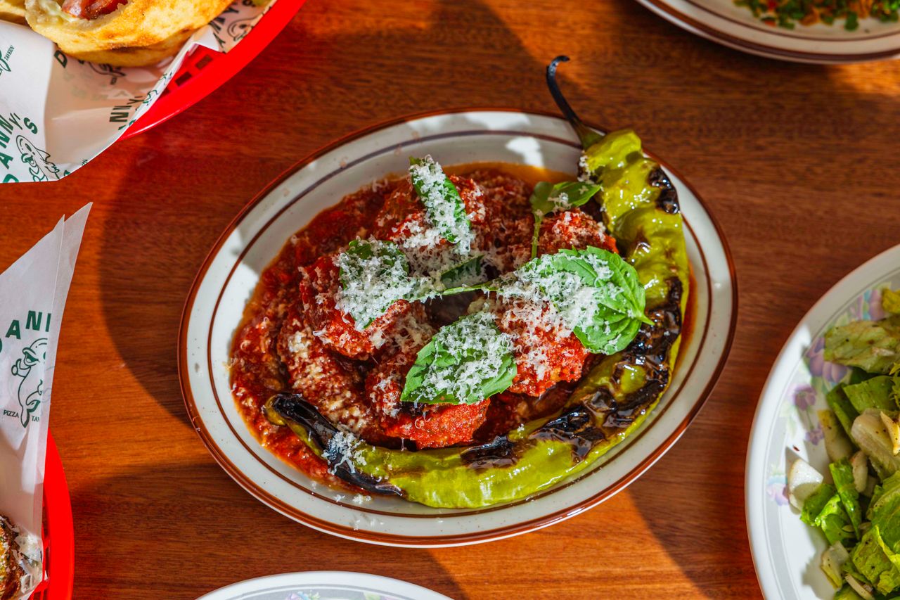 A plate of meatballs in marinara sauce