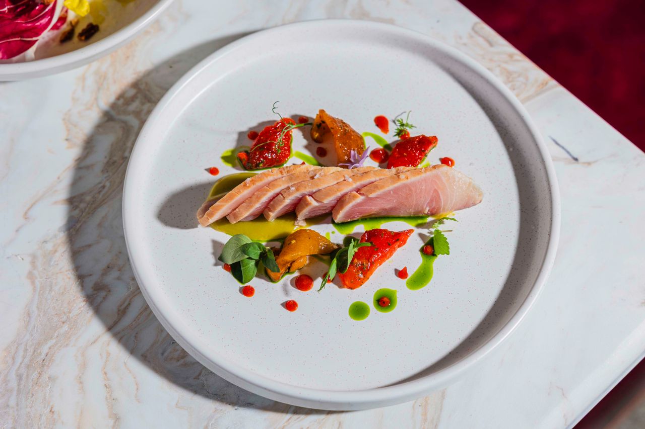 Cured and smoked amberjack with olive purée, herb oil, micro herbs and chargrilled bell pepper