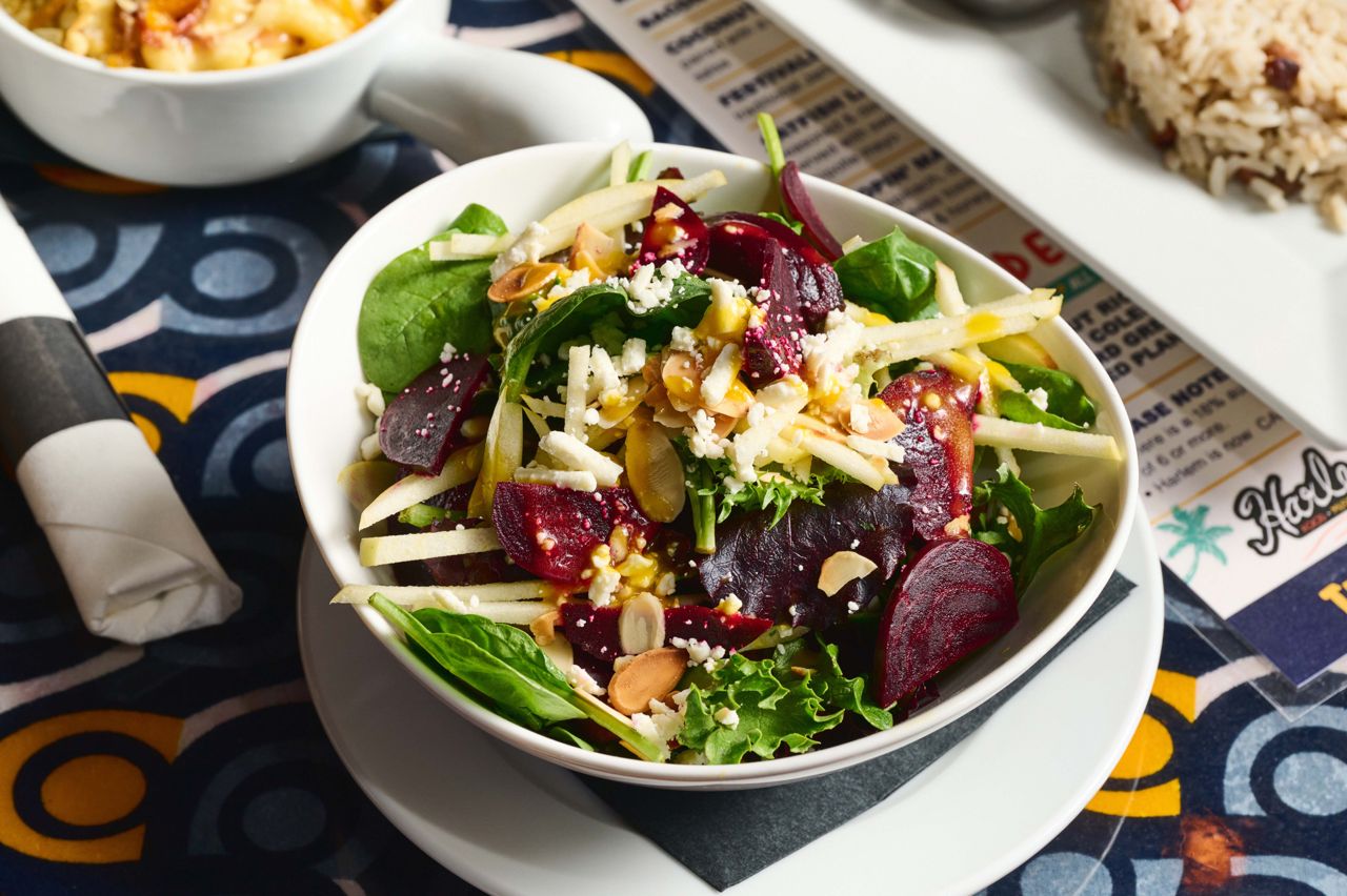 A salad of roasted beets and fresh spinach