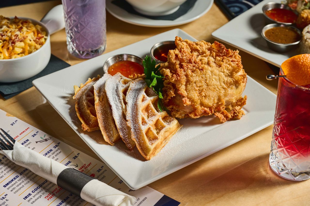 Bone-in fried chicken on a crisp, golden waffle, served with sweet chili sauce and syrup