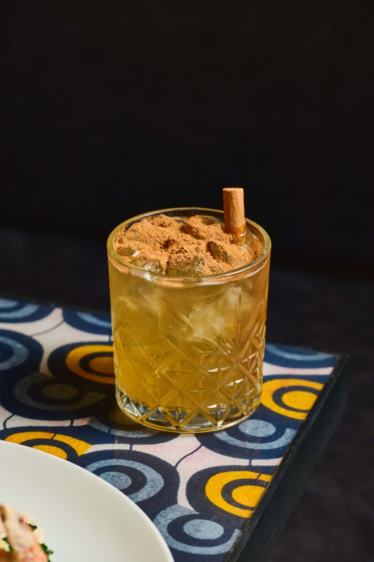 With dark rum, honey syrup, and cinnamon bitters, the Harlem Heatwave is warming—but still light enough for summer