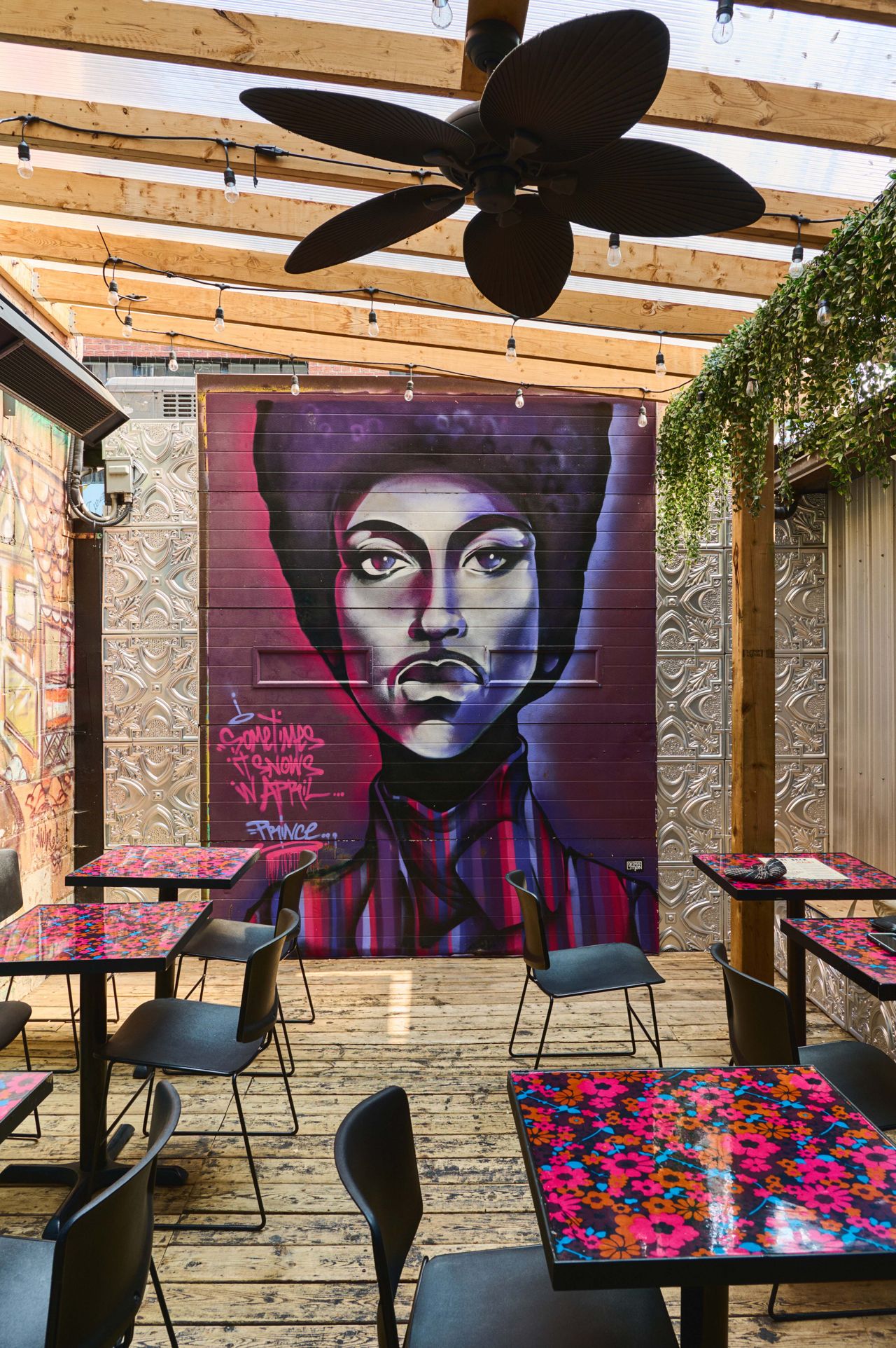 A mural of Prince on the patio at Harlem Restaurant in Toronto
