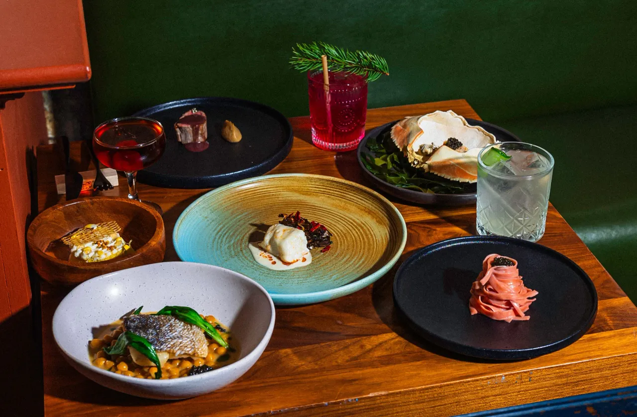 A spread of dishes and drinks at Radici Project