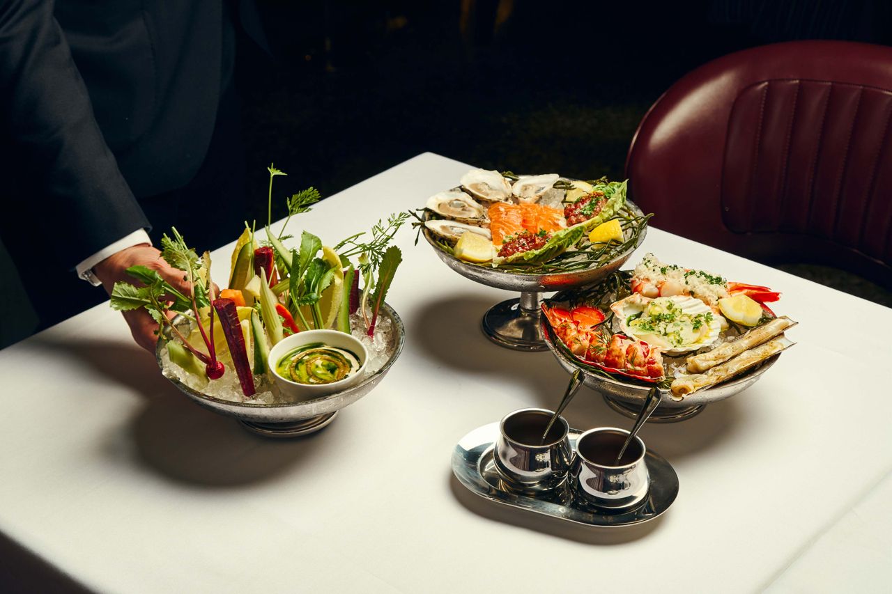 Crudités with bagna cauda and a spread of raw seafood