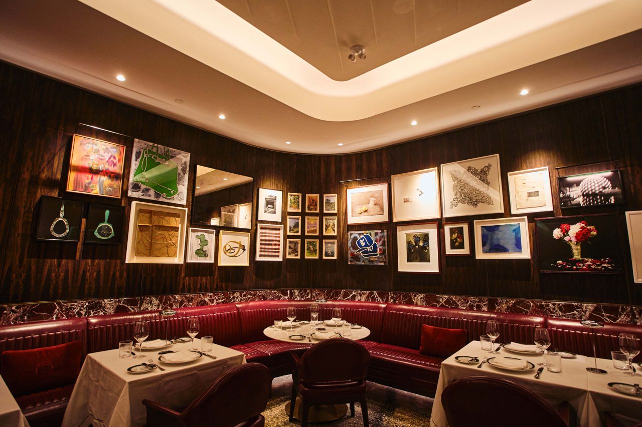Curved banquette seating in the dining room of Sammarco, an Italian steakhouse