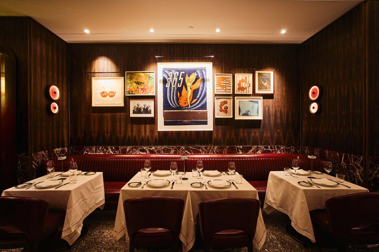 Oxblood-red leather banquette seating in the dining room of Bisteccheria Sammarco