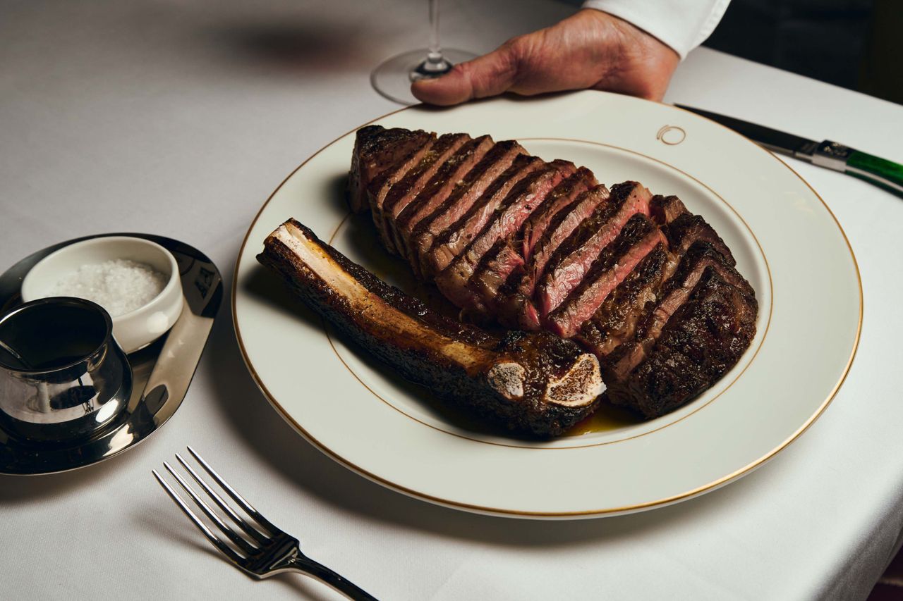 A 32-ounce ribeye is finished simply with sea salt and olive oil, and served with a side of salmoriglio—a zesty Sicilian sauce of oregano, garlic, lemon, chili and olive oil—along with Maldon salt