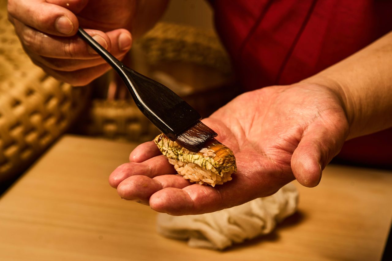 Delicate oboro kombu (thinly shaved kelp) is wrapped around lobes of uni and finished with a soy glaze