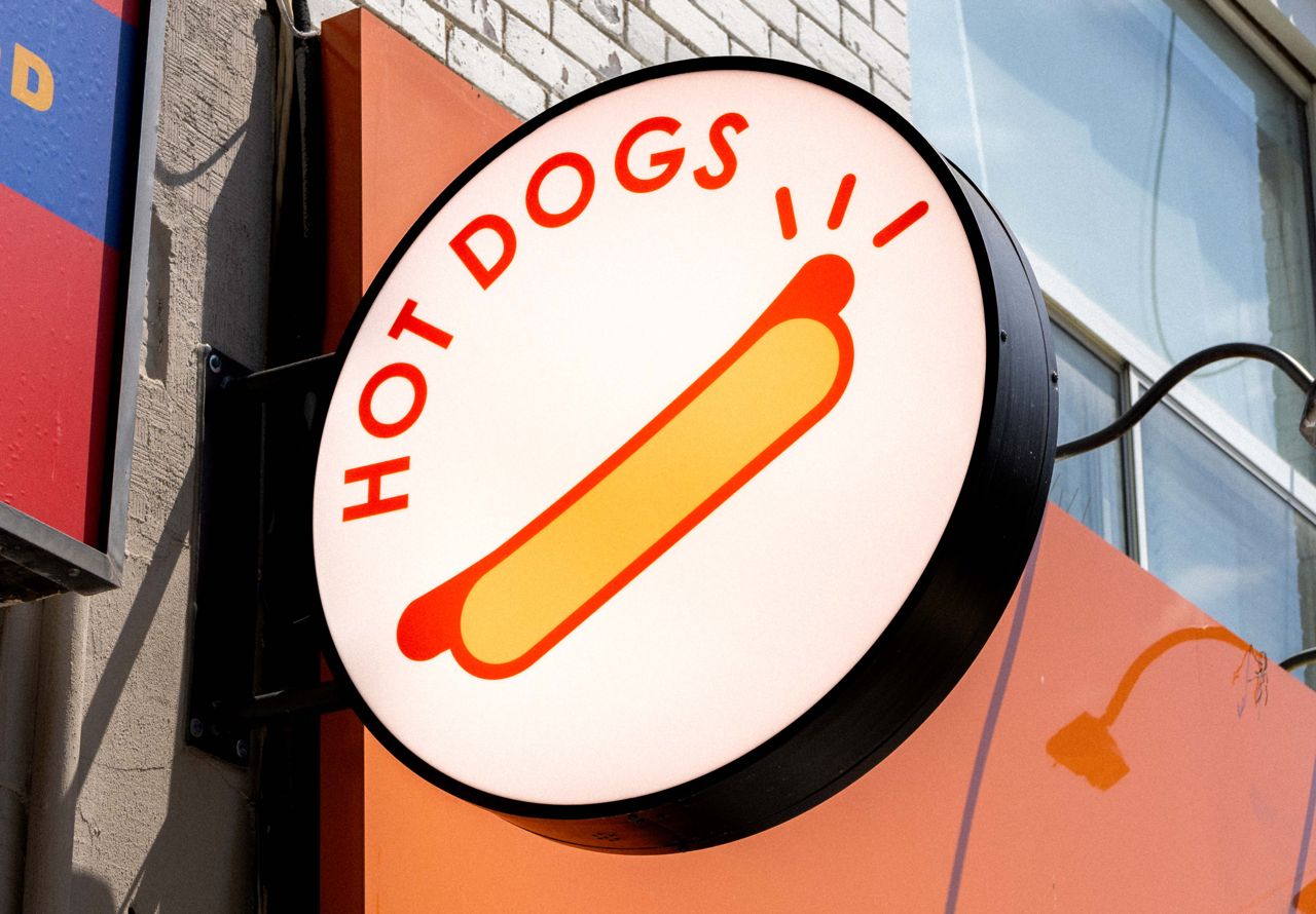 The sign outside of Tino's, a hot dog restaurant in Toronto