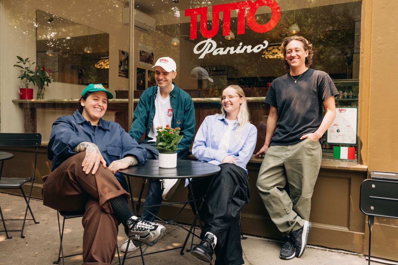 Charlotte Day Wilson and the rest of the Tutto Panino team pose outside of the sandwich shop