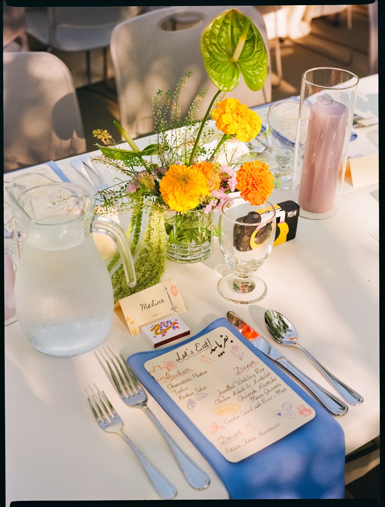 A table setting at Melina and Zach's garden wedding