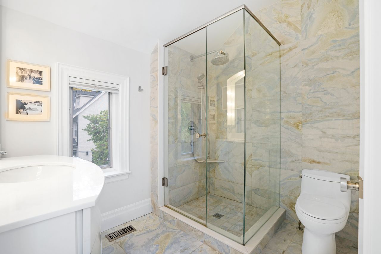 $2.5 million for a Rosedale Tudor with a staircase made of curved glass