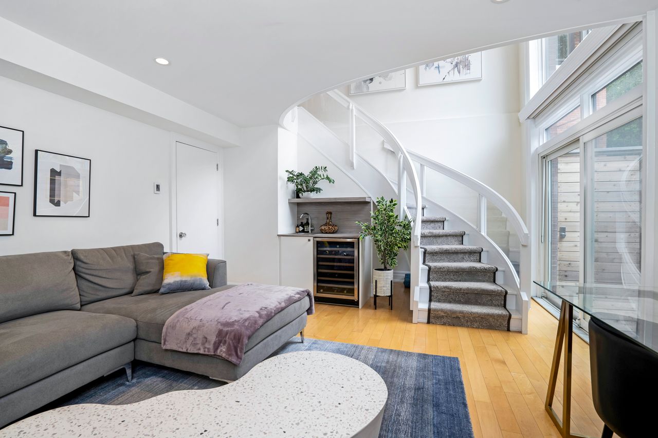 $2.5 million for a Rosedale Tudor with a staircase made of curved glass