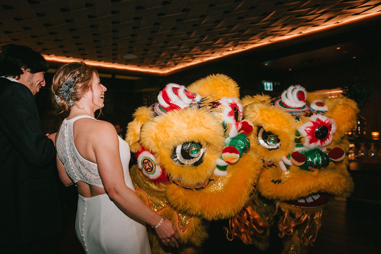 Caroline and Mauricio with lion dancers