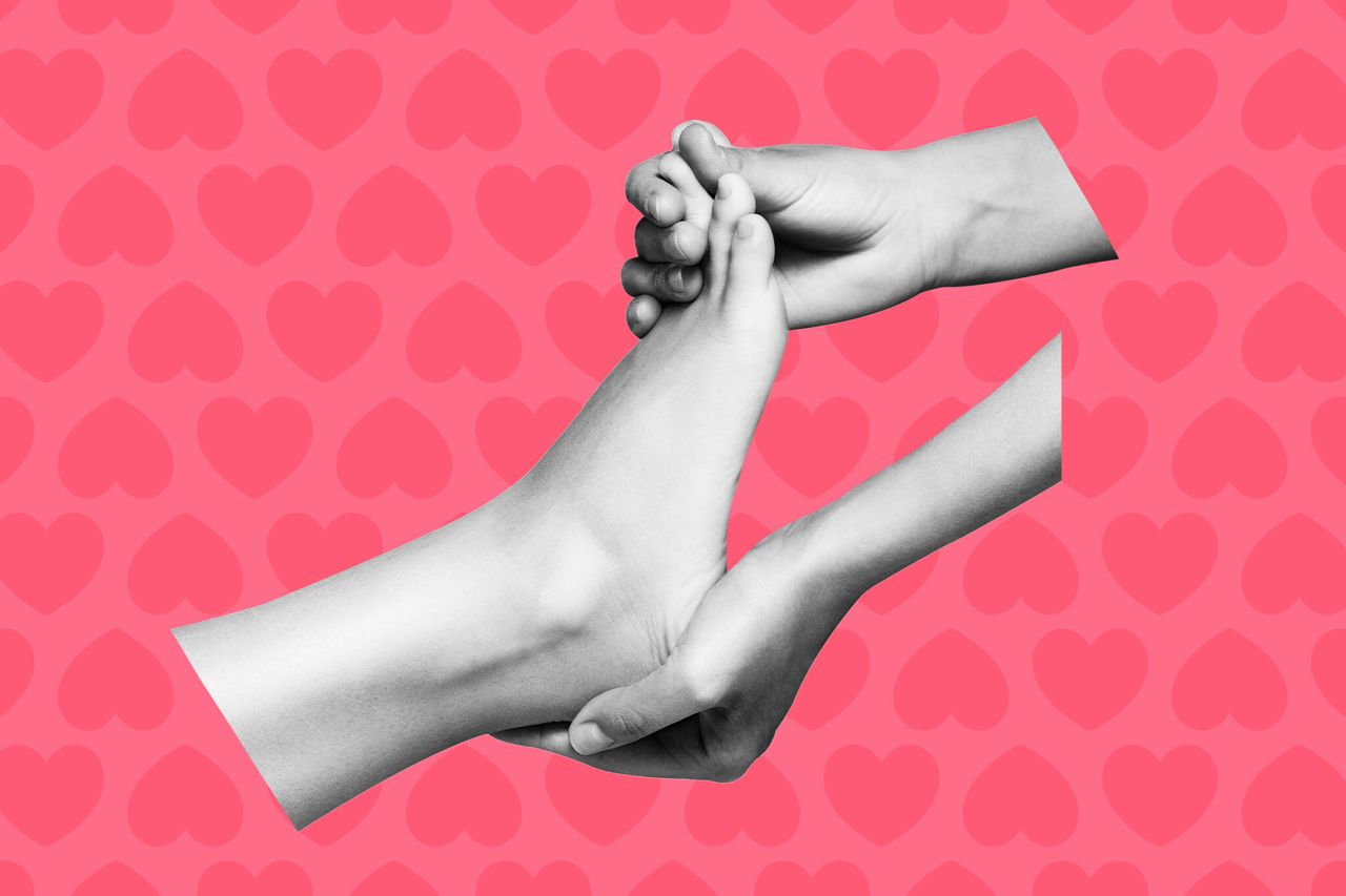 A stylized image of two hands holding a foot