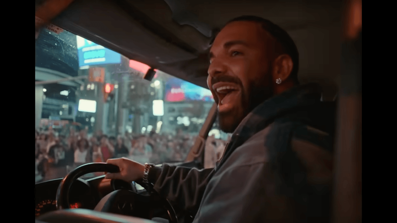 Drake driving an Iceman truck around downtown Toronto, singing along to tracks from his new album