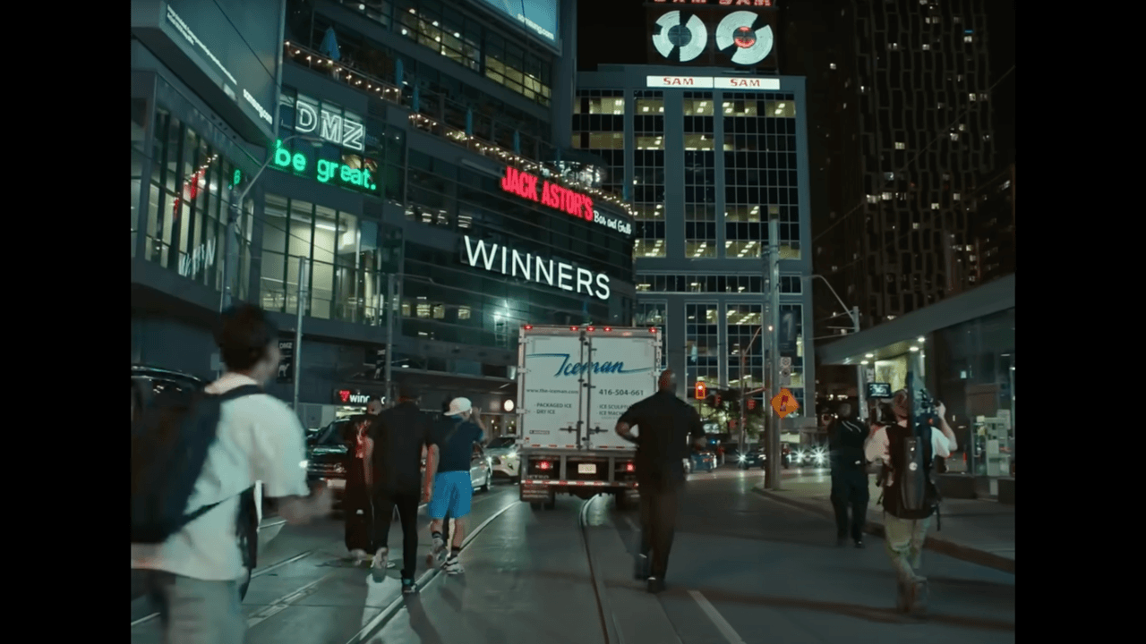 Fans chasing an ice delivery truck driven by Drake around downtown Toronto