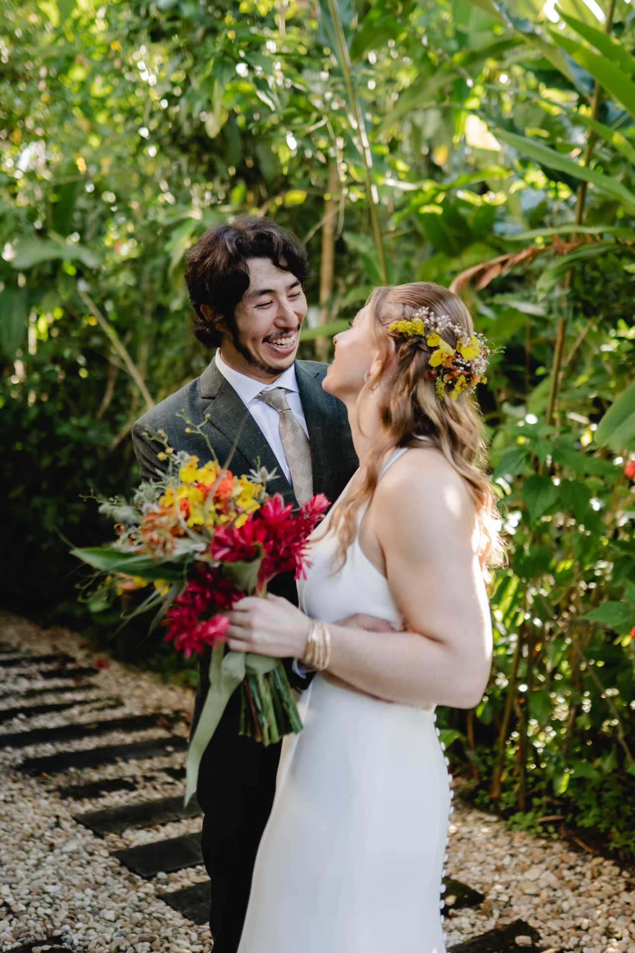 Caroline and Mauricio standing amongst greenery in Brazil