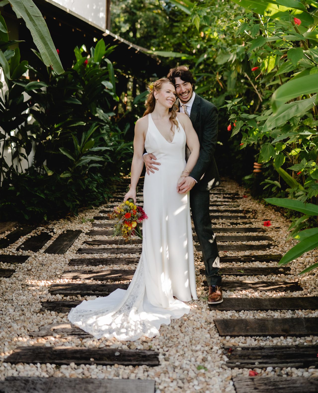 Caroline and Mauricio, standing outside at their Brazil wedding