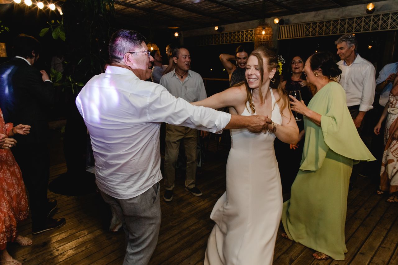 Caroline dancing with a guest at her wedding