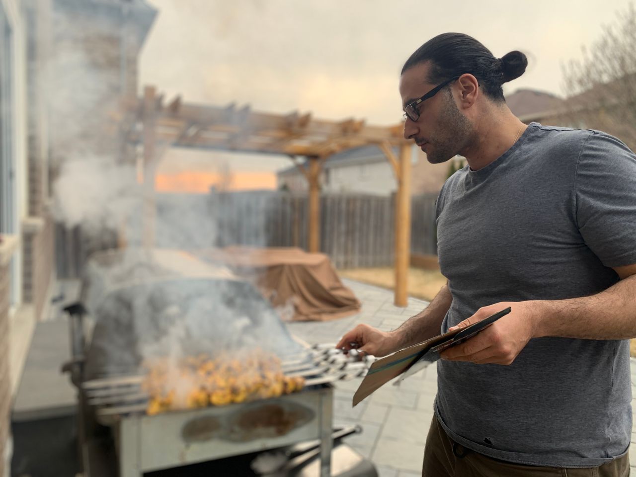 Chef Barbode Soudi cooks kebabs over a charcoal grill