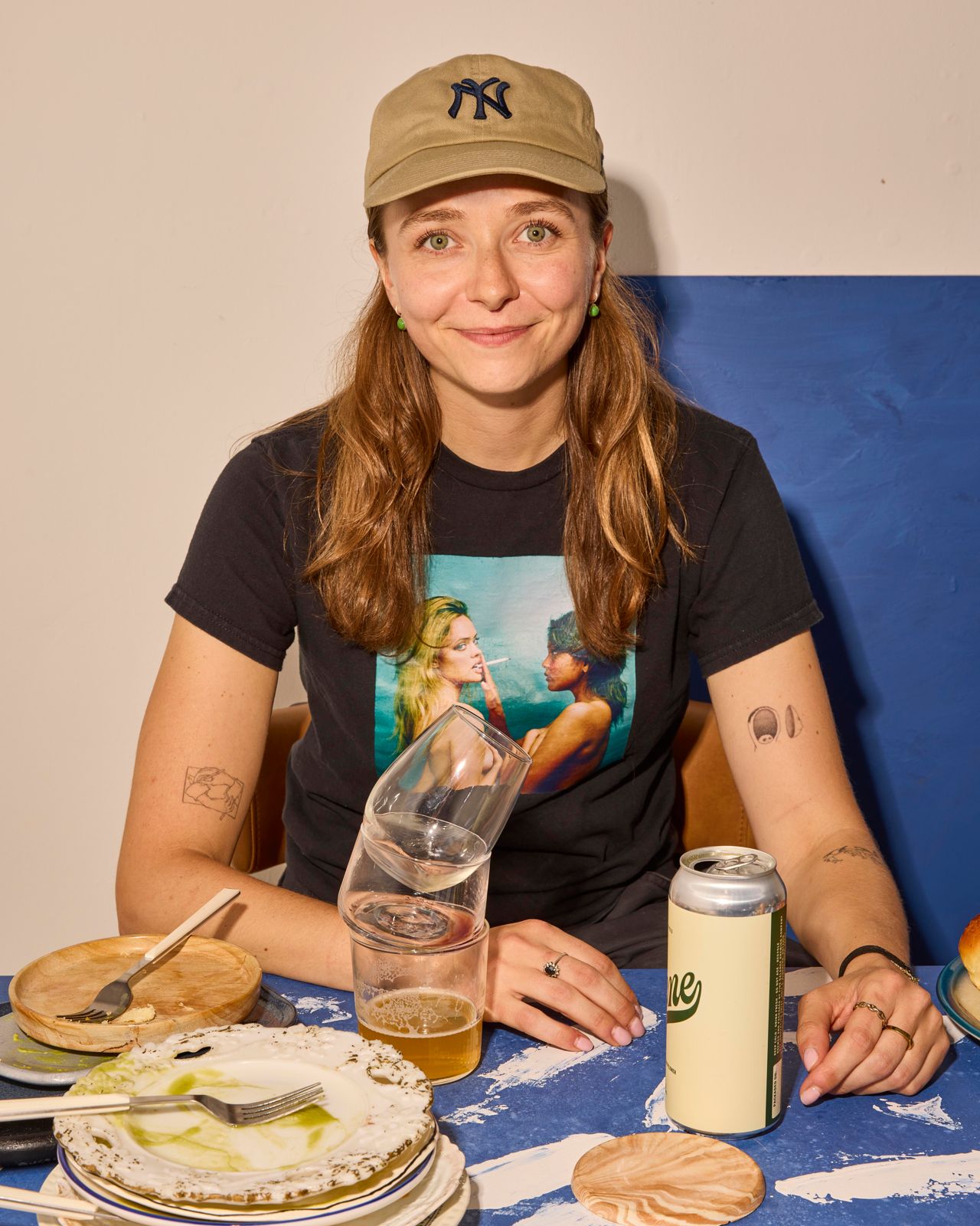 Chef Maddy Goldberg at a table loaded with dirty dishes