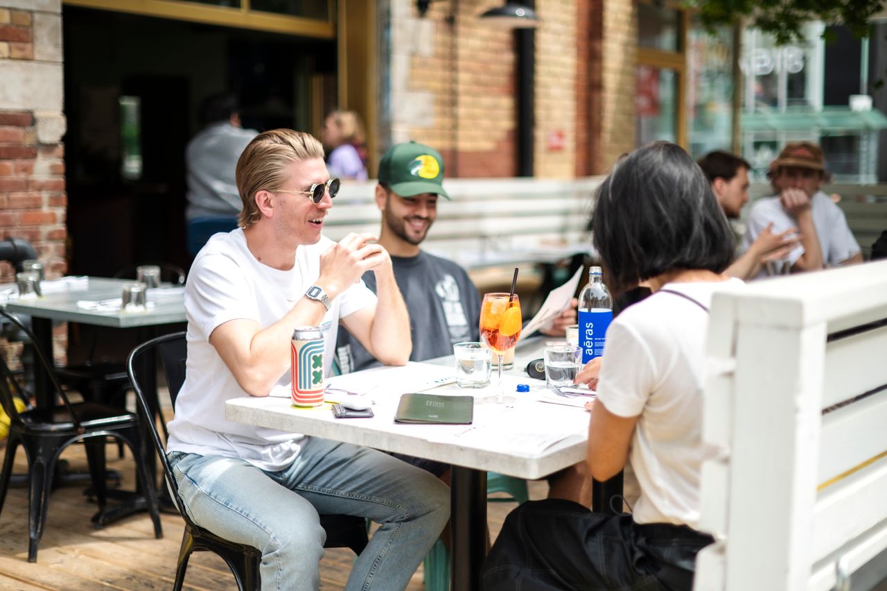 People sit on the patio at the Drake Hotel in Toronto