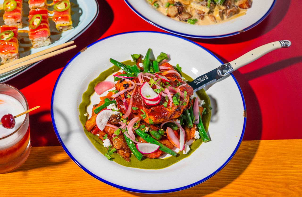 A Mexican chicken dish with beans, pickled onions and radish