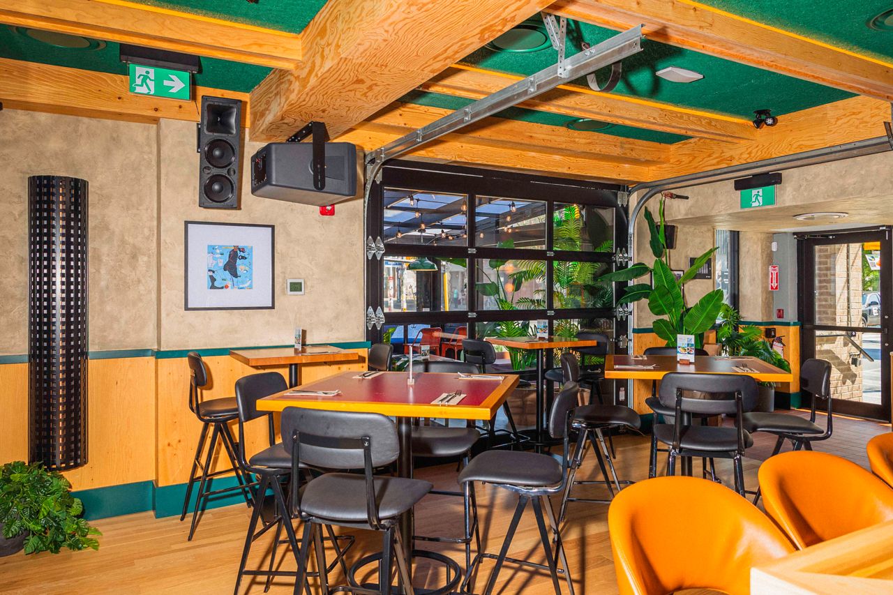 The front dining room, next to a roll-up garage window, at Central