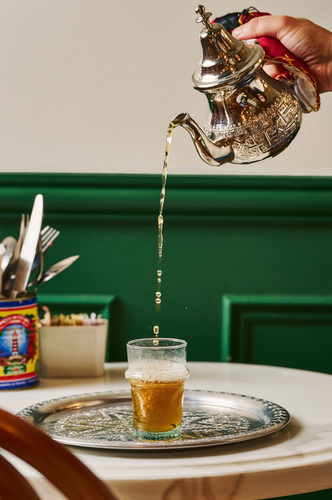 Hot Moroccan mint tea, brewed fresh with spearmint and poured from a height for that essential frothy finish
