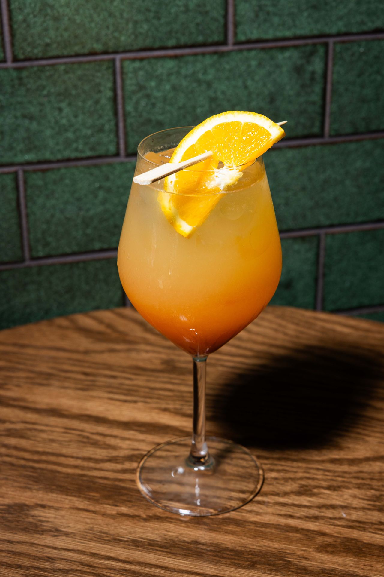 The Sicilian Sunset is a juicy, citrus-forward cocktail built with blood orange amaro, Amaretto, gin and orange juice